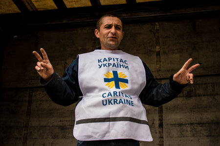 Home delivery of supplies by truck in Dnipro area to a family. Caritas Ukraine provides humanitarian aid and supports communities affected by the long-term impacts of the conflict, including emergency supplies, education and healthcareのeditorial素材