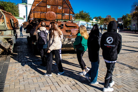 People visiting an open air exhibition and features Russian military equipment that was captured and destroyed during the 2022 Russian invasion of Ukraineのeditorial素材