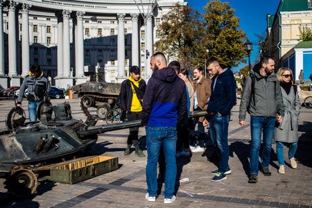 People visiting an open air exhibition and features Russian military equipment that was captured and destroyed during the 2022 Russian invasion of Ukraineのeditorial素材