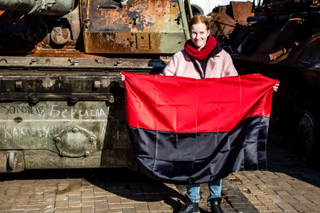 People visiting an open air exhibition and features Russian military equipment that was captured and destroyed during the 2022 Russian invasion of Ukraineのeditorial素材