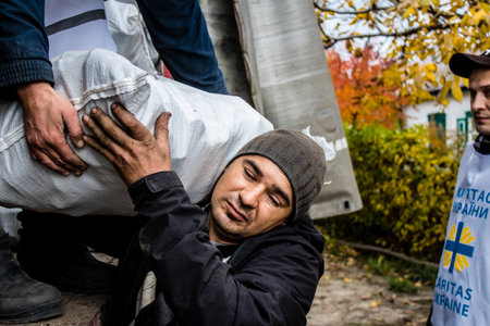 Home delivery of supplies by truck in Dnipro area to a family. Caritas Ukraine provides humanitarian aid and supports communities affected by the long-term impacts of the conflict, including emergency supplies, education and healthcareのeditorial素材