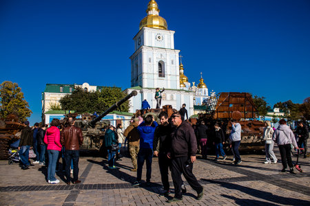 People visiting an open air exhibition and features Russian military equipment that was captured and destroyed during the 2022 Russian invasion of Ukraineのeditorial素材