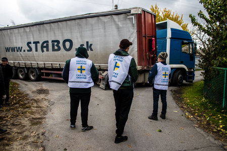 Home delivery of supplies by truck in Dnipro area to a family. Caritas Ukraine provides humanitarian aid and supports communities affected by the long-term impacts of the conflict, including emergency supplies, education and healthcareのeditorial素材