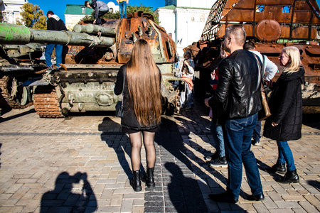 People visiting an open air exhibition and features Russian military equipment that was captured and destroyed during the 2022 Russian invasion of Ukraineのeditorial素材