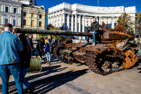 People visiting an open air exhibition and features Russian military equipment that was captured and destroyed during the 2022 Russian invasion of Ukraineのeditorial素材