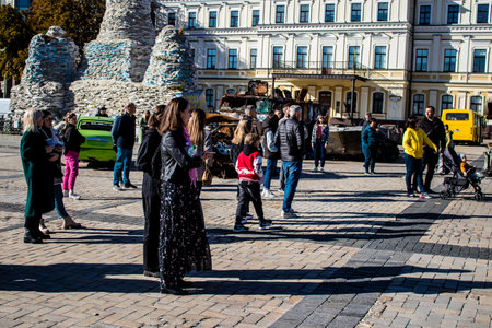 People visiting an open air exhibition and features Russian military equipment that was captured and destroyed during the 2022 Russian invasion of Ukraineのeditorial素材
