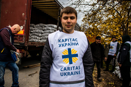 Home delivery of supplies by truck in Dnipro area to a family. Caritas Ukraine provides humanitarian aid and supports communities affected by the long-term impacts of the conflict, including emergency supplies, education and healthcareのeditorial素材