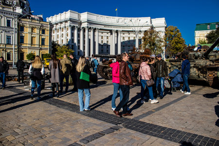 People visiting an open air exhibition and features Russian military equipment that was captured and destroyed during the 2022 Russian invasion of Ukraineのeditorial素材