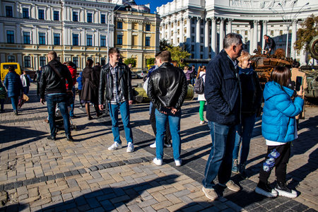 People visiting an open air exhibition and features Russian military equipment that was captured and destroyed during the 2022 Russian invasion of Ukraineのeditorial素材