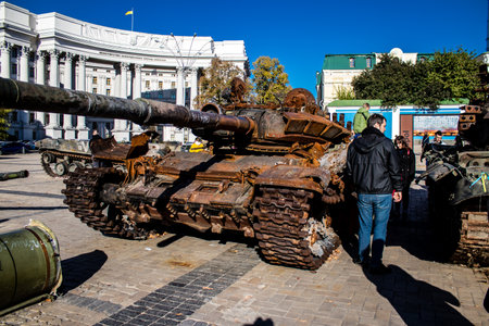 People visiting an open air exhibition and features Russian military equipment that was captured and destroyed during the 2022 Russian invasion of Ukraineのeditorial素材