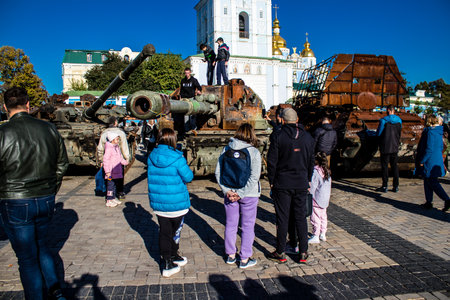 People visiting an open air exhibition and features Russian military equipment that was captured and destroyed during the 2022 Russian invasion of Ukraineのeditorial素材