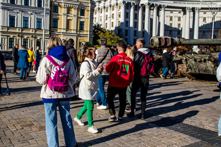 People visiting an open air exhibition and features Russian military equipment that was captured and destroyed during the 2022 Russian invasion of Ukraineのeditorial素材