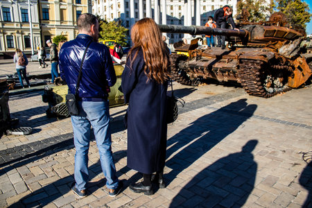 People visiting an open air exhibition and features Russian military equipment that was captured and destroyed during the 2022 Russian invasion of Ukraineのeditorial素材