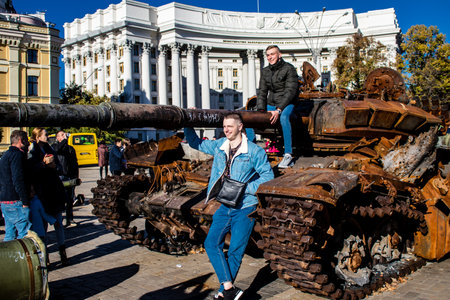 People visiting an open air exhibition and features Russian military equipment that was captured and destroyed during the 2022 Russian invasion of Ukraineのeditorial素材