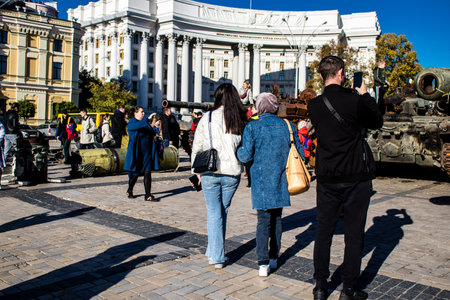 People visiting an open air exhibition and features Russian military equipment that was captured and destroyed during the 2022 Russian invasion of Ukraineのeditorial素材