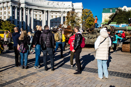 People visiting an open air exhibition and features Russian military equipment that was captured and destroyed during the 2022 Russian invasion of Ukraineのeditorial素材