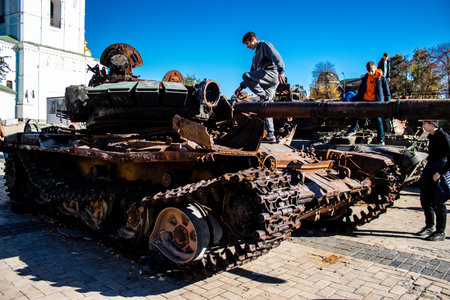 People visiting an open air exhibition and features Russian military equipment that was captured and destroyed during the 2022 Russian invasion of Ukraineのeditorial素材