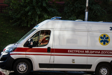 Kyiv, Ukraine - November 02, 2022 Ambulance rolling in the city center of kyiv during the war with Russia, kyiv are the target of Russian missiles and the sirens sound every dayのeditorial素材