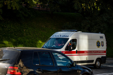 Kyiv, Ukraine - November 02, 2022 Ambulance rolling in the city center of kyiv during the war with Russia, kyiv are the target of Russian missiles and the sirens sound every dayのeditorial素材