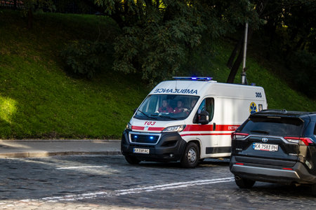 Kyiv, Ukraine - November 02, 2022 Ambulance rolling in the city center of kyiv during the war with Russia, kyiv are the target of Russian missiles and the sirens sound every dayのeditorial素材
