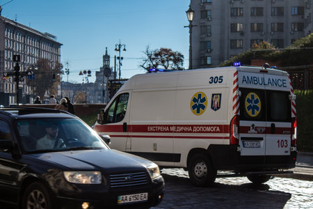 Kyiv, Ukraine - November 02, 2022 Ambulance rolling in the city center of kyiv during the war with Russia, kyiv are the target of Russian missiles and the sirens sound every dayのeditorial素材
