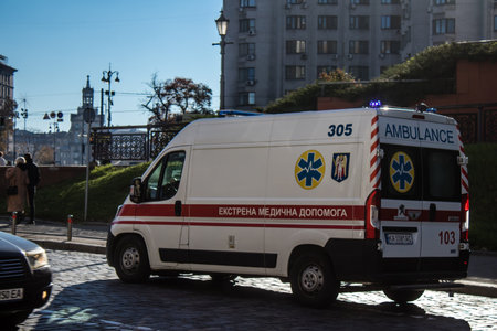 Kyiv, Ukraine - November 02, 2022 Ambulance rolling in the city center of kyiv during the war with Russia, kyiv are the target of Russian missiles and the sirens sound every dayのeditorial素材