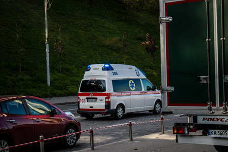 Kyiv, Ukraine - November 02, 2022 Ambulance rolling in the city center of kyiv during the war with Russia, kyiv are the target of Russian missiles and the sirens sound every dayのeditorial素材