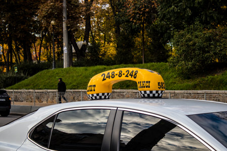 Kyiv, Ukraine - November 02, 2022 Taxi driving in the city center of kyiv during the war with...