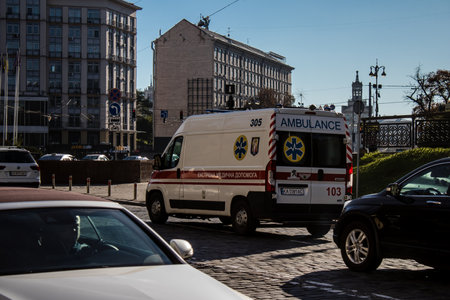 Kyiv, Ukraine - November 02, 2022 Ambulance rolling in the city center of kyiv during the war with Russia, kyiv are the target of Russian missiles and the sirens sound every dayのeditorial素材