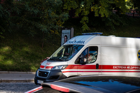 Kyiv, Ukraine - November 02, 2022 Ambulance rolling in the city center of kyiv during the war with Russia, kyiv are the target of Russian missiles and the sirens sound every dayのeditorial素材