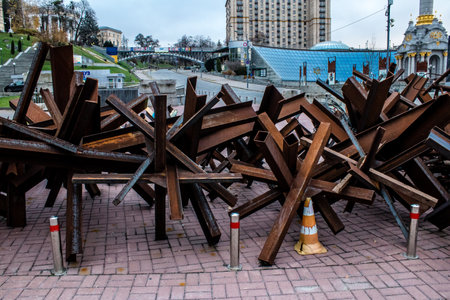 Military roadblock and obstacles in the streets Kyiv capital of Ukraine. The objective is to prevent any enemy operation. It acts as protection for friendly troops. The preparation of such a barrage is normally a priority engineer task.のeditorial素材