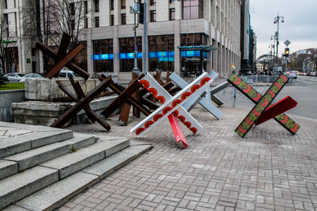 Military roadblock and obstacles in the streets Kyiv capital of Ukraine. The objective is to prevent any enemy operation. It acts as protection for friendly troops. The preparation of such a barrage is normally a priority engineer task.のeditorial素材