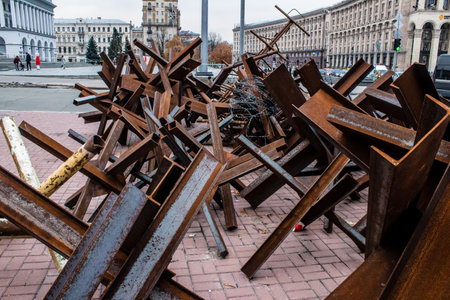 Military roadblock and obstacles in the streets Kyiv capital of Ukraine. The objective is to prevent any enemy operation. It acts as protection for friendly troops. The preparation of such a barrage is normally a priority engineer task.のeditorial素材