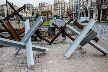 Military roadblock and obstacles in the streets Kyiv capital of Ukraine. The objective is to prevent any enemy operation. It acts as protection for friendly troops. The preparation of such a barrage is normally a priority engineer task.のeditorial素材