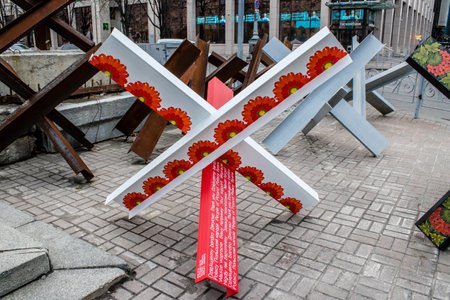 Military roadblock and obstacles in the streets Kyiv capital of Ukraine. The objective is to prevent any enemy operation. It acts as protection for friendly troops. The preparation of such a barrage is normally a priority engineer task.のeditorial素材