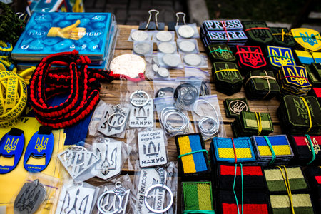 Decorative objects sold on the streets of kyiv in Ukraine, unit patches and other wartime memorabilia revolve around the military spirit and are bought by people as souvenirs on the current war against Russia. The vendors, who have sold trinkets on their のeditorial素材