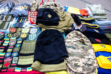 Decorative objects sold on the streets of kyiv in Ukraine, unit patches and other wartime memorabilia revolve around the military spirit and are bought by people as souvenirs on the current war against Russia. The vendors, who have sold trinkets on their のeditorial素材