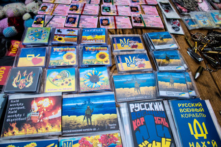 Decorative objects sold on the streets of kyiv in Ukraine, unit patches and other wartime memorabilia revolve around the military spirit and are bought by people as souvenirs on the current war against Russia. The vendors, who have sold trinkets on their のeditorial素材