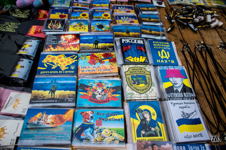Decorative objects sold on the streets of kyiv in Ukraine, unit patches and other wartime memorabilia revolve around the military spirit and are bought by people as souvenirs on the current war against Russia. The vendors, who have sold trinkets on their のeditorial素材