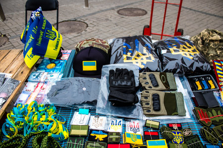 Decorative objects sold on the streets of kyiv in Ukraine, unit patches and other wartime memorabilia revolve around the military spirit and are bought by people as souvenirs on the current war against Russia. The vendors, who have sold trinkets on their のeditorial素材