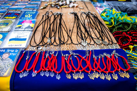 Decorative objects sold on the streets of kyiv in Ukraine, unit patches and other wartime memorabilia revolve around the military spirit and are bought by people as souvenirs on the current war against Russia. The vendors, who have sold trinkets on their のeditorial素材