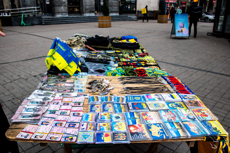 Decorative objects sold on the streets of kyiv in Ukraine, unit patches and other wartime memorabilia revolve around the military spirit and are bought by people as souvenirs on the current war against Russia. The vendors, who have sold trinkets on their のeditorial素材