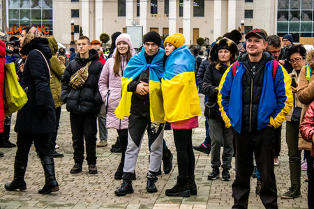 Some citizens of Kherson wearing the flag of Ukraine in the form of a cape celebrate the liberation of the city on Freedom Square in the city center. Russian troops left Kherson after a nine-month occupation and a counter offensive by the Ukrainian army.のeditorial素材