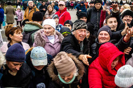 Residents of Kherson, Ukraine, receive food supplies in Freedom Square. The tension is very strong and people are very exasperated. International humanitarian aid is organized when people lack everything.のeditorial素材