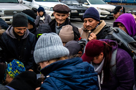Residents of Kherson, Ukraine, receive food supplies in Freedom Square. The tension is very strong and people are very exasperated. International humanitarian aid is organized when people lack everything.のeditorial素材