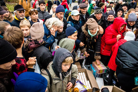 Residents of Kherson, Ukraine, receive food supplies in Freedom Square. The tension is very strong and people are very exasperated. International humanitarian aid is organized when people lack everything.のeditorial素材