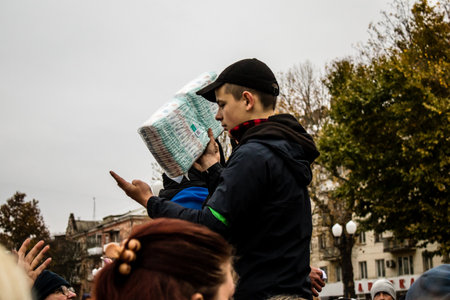 Citizens of Kherson receive humanitarian aid at Freedom Square in the city center. Russian troops left Kherson after a nine-month occupation and a counter-offensive by the Ukrainian armyのeditorial素材
