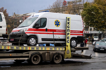 The Ukrainian government delivers ambulances to the city of Kherson, the vehicles are transported by truck to the hospital where the ambulances will be put into service. Russian troops left Kherson after a nine-month occupation and a counter-offensive by のeditorial素材
