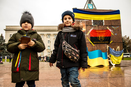 kid of Kherson celebrate the liberation of the city on Freedom Square in the city center. Russian troops left Kherson after a nine-month occupationのeditorial素材