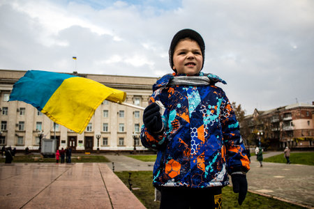 kid of Kherson celebrate the liberation of the city on Freedom Square in the city center. Russian troops left Kherson after a nine-month occupationのeditorial素材